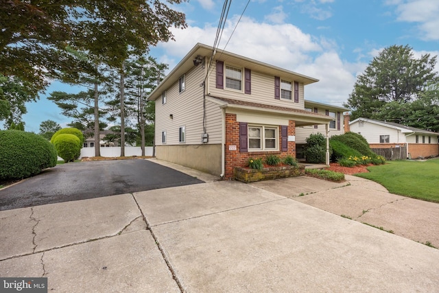 64 Warwick Rd, Stratford, NJ 08084 - view of front of home with brick siding, asphalt driveway, and covered porch