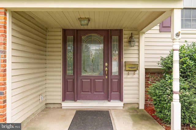 64 Warwick Rd, Stratford, NJ 08084 - property entrance featuring brick siding and a porch