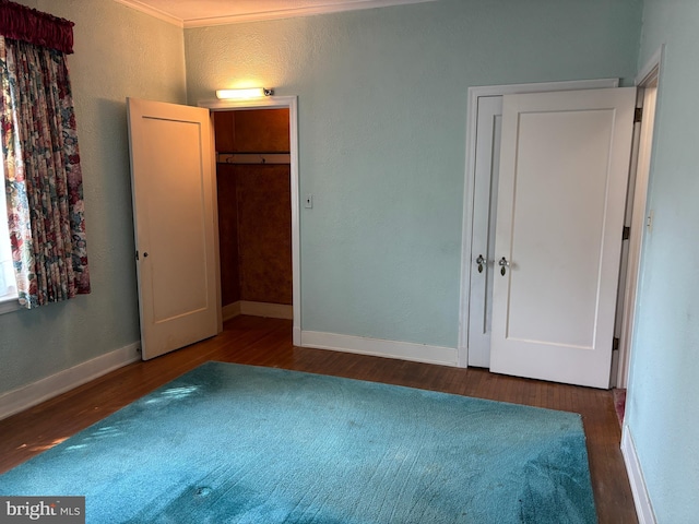 400 E Main St, Ephrata, PA 17522 - bedroom featuring wood finished floors, a textured wall, and ornamental molding