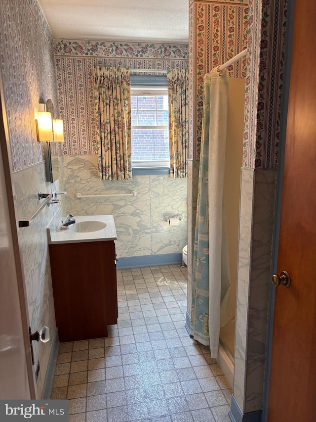 400 E Main St, Ephrata, PA 17522 - full bathroom featuring wallpapered walls, vanity, and a stall shower