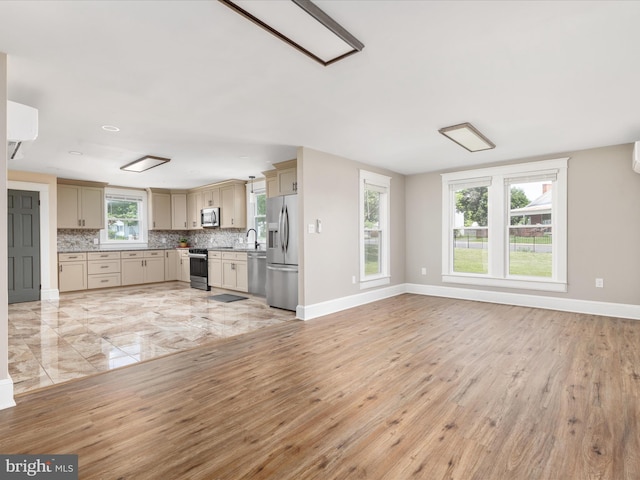 232 Crawford St, Strasburg, VA 22657 - unfurnished living room featuring baseboards and light wood finished floors