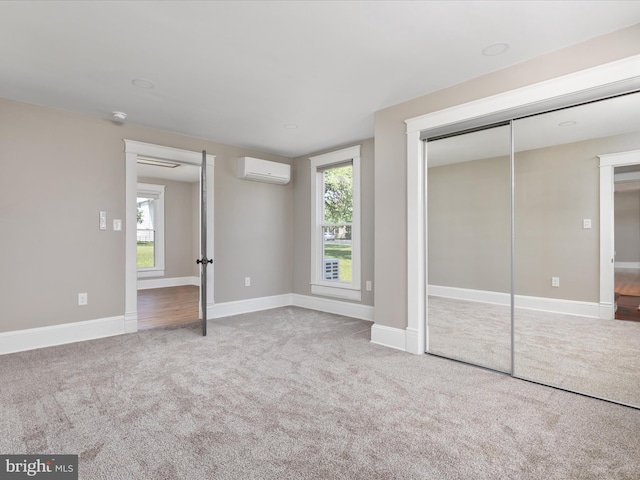 232 Crawford St, Strasburg, VA 22657 - unfurnished bedroom featuring an AC wall unit, carpet floors, and a closet