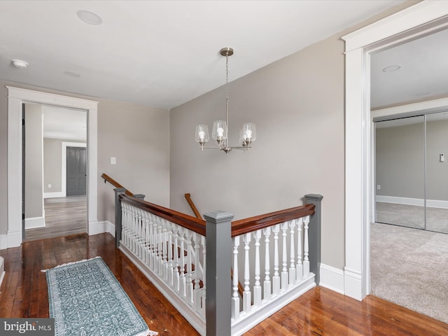 232 Crawford St, Strasburg, VA 22657 - hall featuring an upstairs landing, wood finished floors, and a chandelier