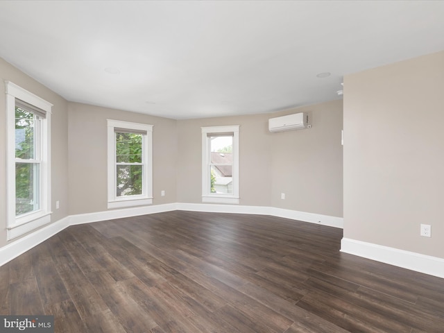 232 Crawford St, Strasburg, VA 22657 - spare room featuring a wall unit AC and dark wood-style floors