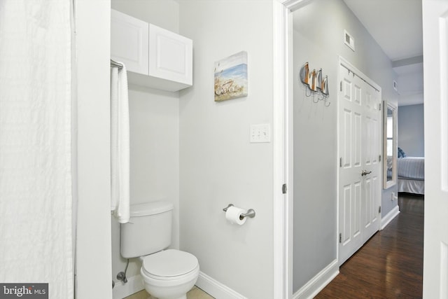110 S Washington St, Havre De Grace, MD 21078 - ensuite bathroom featuring toilet and wood finished floors