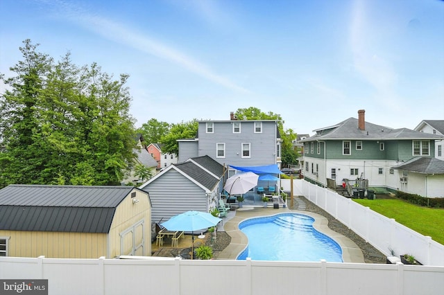 110 S Washington St, Havre De Grace, MD 21078 - view of swimming pool with a fenced backyard, an outbuilding, a residential view, and a patio