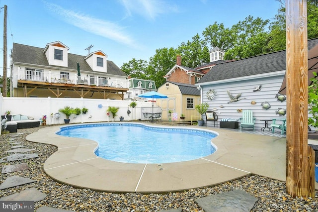 110 S Washington St, Havre De Grace, MD 21078 - view of swimming pool with a fenced backyard, a patio, and a storage unit