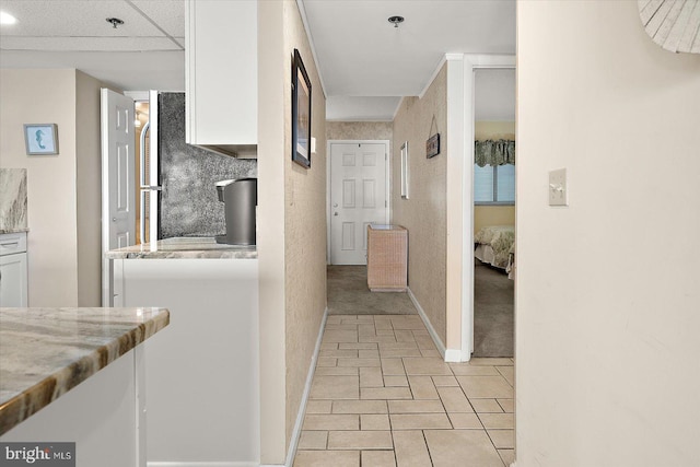 9800 Coastal Hwy Unit 1207, Ocean City, MD 21842 - corridor featuring baseboards and light tile patterned floors