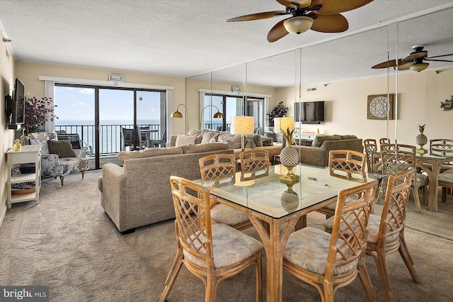 9800 Coastal Hwy Unit 1207, Ocean City, MD 21842 - dining space with a ceiling fan, carpet floors, and a textured ceiling