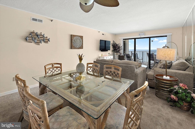 9800 Coastal Hwy Unit 1207, Ocean City, MD 21842 - dining area featuring carpet flooring, ceiling fan, and a textured ceiling