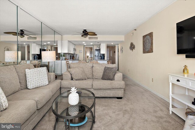 9800 Coastal Hwy Unit 1207, Ocean City, MD 21842 - living room featuring a ceiling fan and light colored carpet