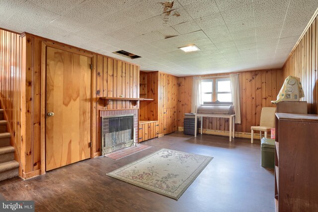 1002 S 2nd Ave, Lebanon, PA 17042 - sitting room featuring a brick fireplace, stairway, and wood walls