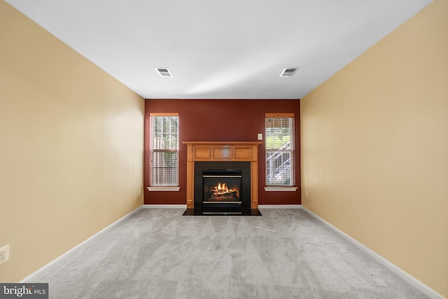 8078 Horseshoe Cottage Cir, Lorton, VA 22079 - unfurnished living room featuring a fireplace with flush hearth and carpet