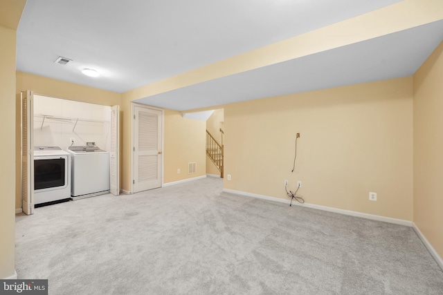 8078 Horseshoe Cottage Cir, Lorton, VA 22079 - unfurnished living room featuring washer and clothes dryer, light carpet, and stairs