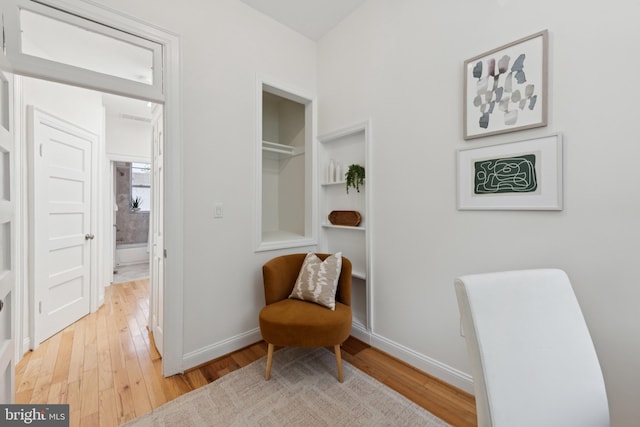 643 Keefer Pl NW, Washington, DC 20010 - living area with light wood finished floors and built in shelves
