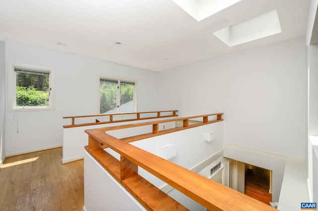906 Old Farm Rd, Charlottesville, VA 22903 - corridor with an upstairs landing, a skylight, wood finished floors, healthy amount of natural light, and recessed lighting