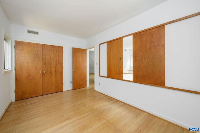 906 Old Farm Rd, Charlottesville, VA 22903 - unfurnished bedroom featuring light wood-type flooring and a closet