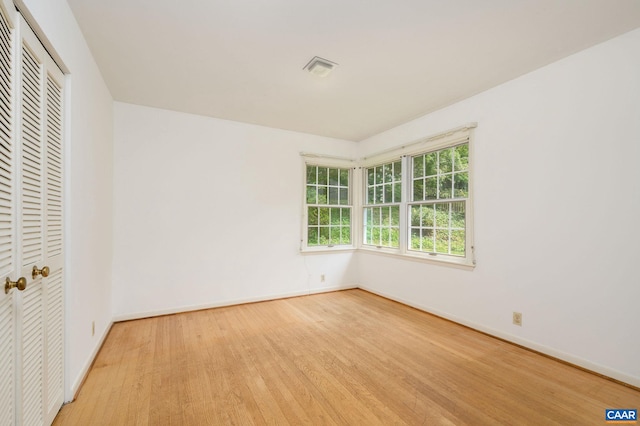906 Old Farm Rd, Charlottesville, VA 22903 - unfurnished bedroom with wood finished floors and a closet