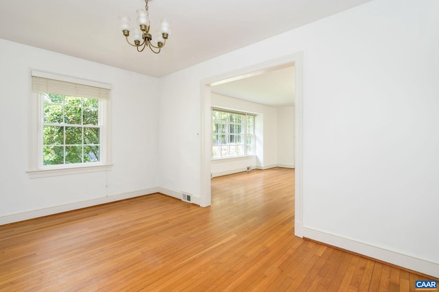 906 Old Farm Rd, Charlottesville, VA 22903 - empty room featuring a chandelier and light wood-style floors