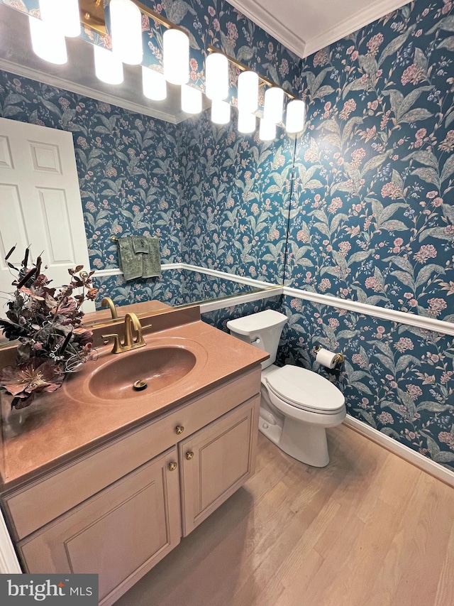 2510 Heatherwood Ct, Hyattsville, MD 20783 - half bathroom with wallpapered walls, wood finished floors, crown molding, and vanity