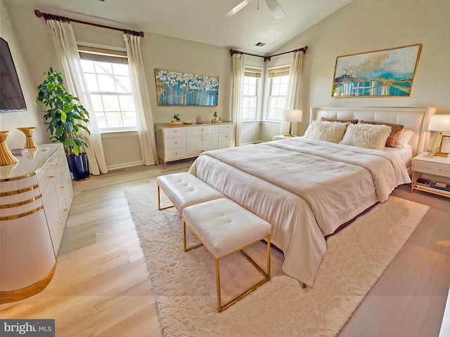 2510 Heatherwood Ct, Hyattsville, MD 20783 - bedroom with multiple windows, vaulted ceiling, light wood finished floors, and a ceiling fan