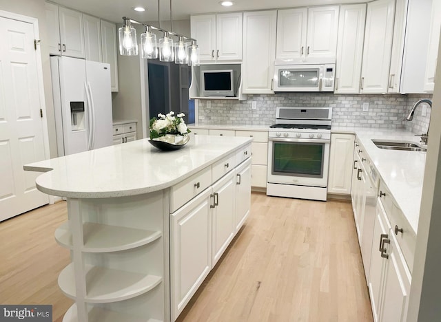 2510 Heatherwood Ct, Hyattsville, MD 20783 - kitchen with white appliances, open shelves, white cabinets, light wood-type flooring, and tasteful backsplash