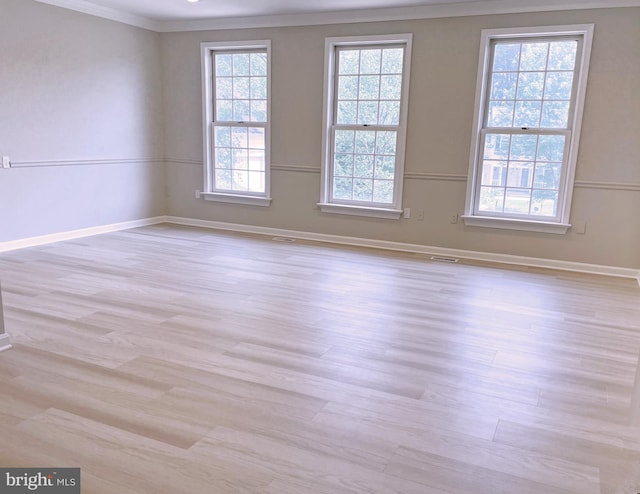2510 Heatherwood Ct, Hyattsville, MD 20783 - spare room featuring crown molding, plenty of natural light, and wood finished floors