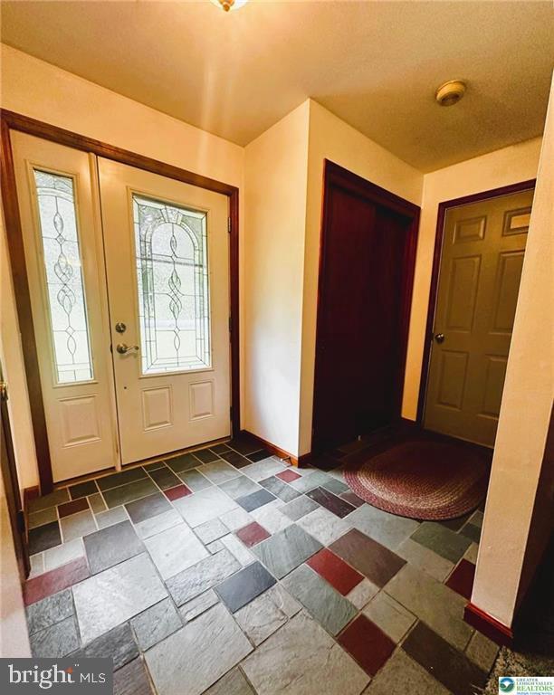 93 Sassafras, Lehighton, PA 18235 - foyer with baseboards and stone tile flooring
