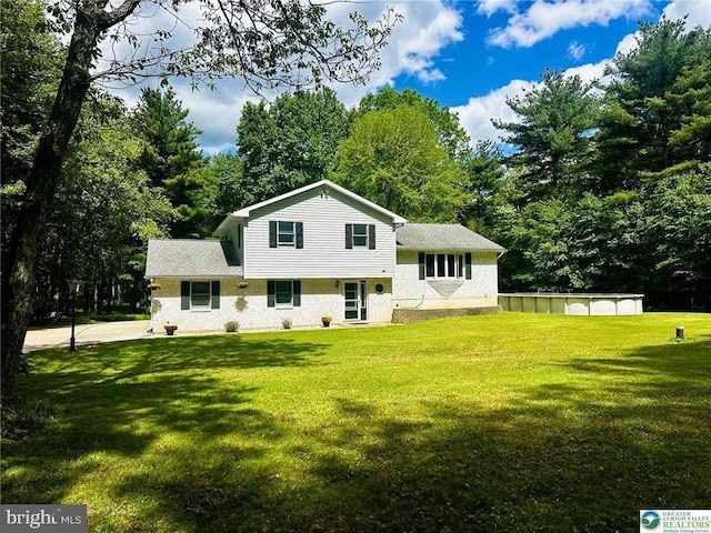 93 Sassafras, Lehighton, PA 18235 - split level home with a front lawn and view of wooded area