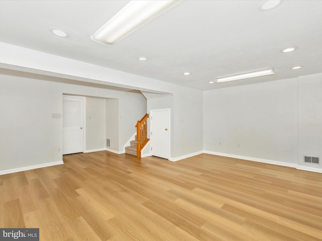 5220 Earles Ct, Frederick, MD 21703 - finished below grade area with light wood-style flooring, stairs, and recessed lighting