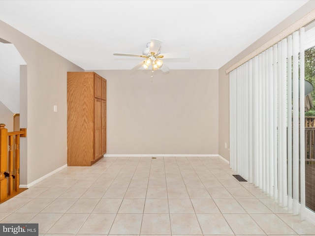 5220 Earles Ct, Frederick, MD 21703 - empty room featuring arched walkways, ceiling fan, and light tile patterned floors