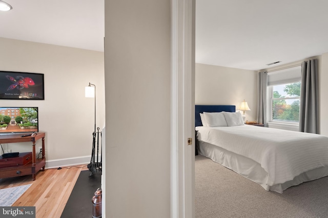 317 10th St NE Unit 13, Washington, DC 20002 - bedroom with wood finished floors and baseboards