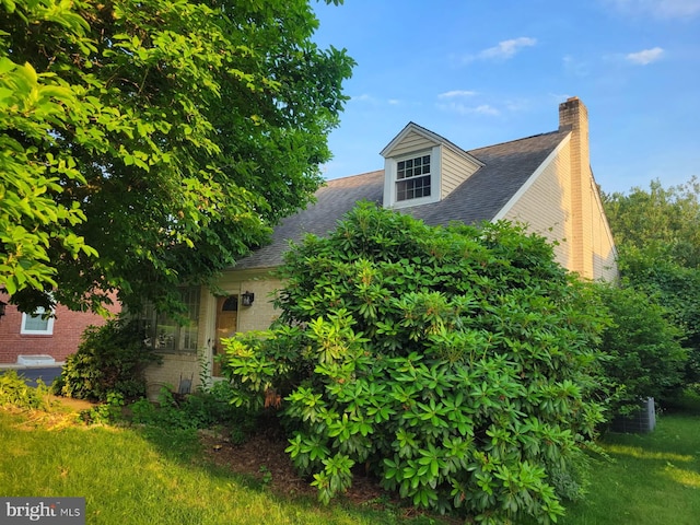 338 Wayne Ave, Springfield, PA 19064 - view of side of home featuring a chimney and a shingled roof