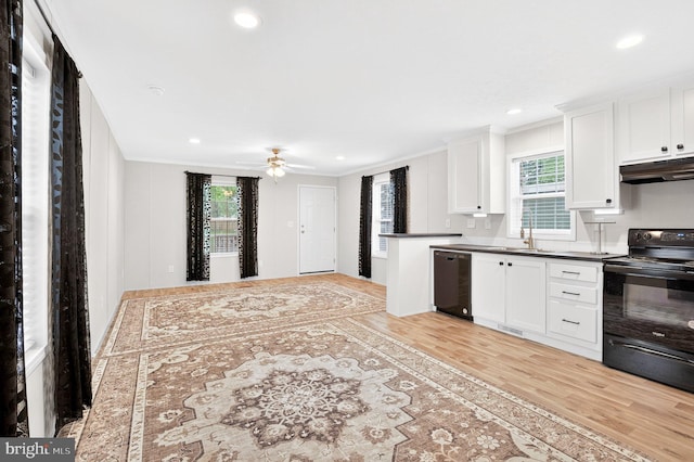 541 Furnace Hills Pike Unit 1, Lititz, PA 17543 - kitchen with black appliances, under cabinet range hood, crown molding, light wood-style floors, and dark countertops