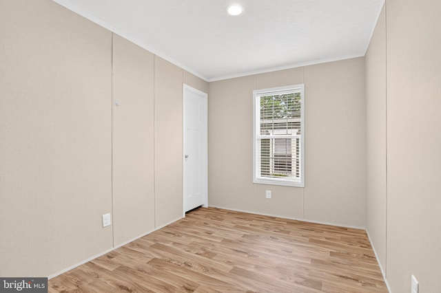 541 Furnace Hills Pike Unit 1, Lititz, PA 17543 - unfurnished bedroom with light wood-style flooring and crown molding