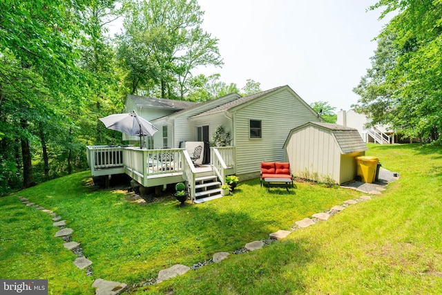 7781 Monaghan Rd, Glen Burnie, MD 21060 - rear view of house with a storage shed, a wooden deck, and a lawn