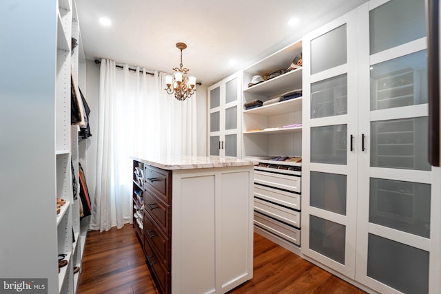 7781 Monaghan Rd, Glen Burnie, MD 21060 - walk in closet featuring dark wood-style flooring and a chandelier