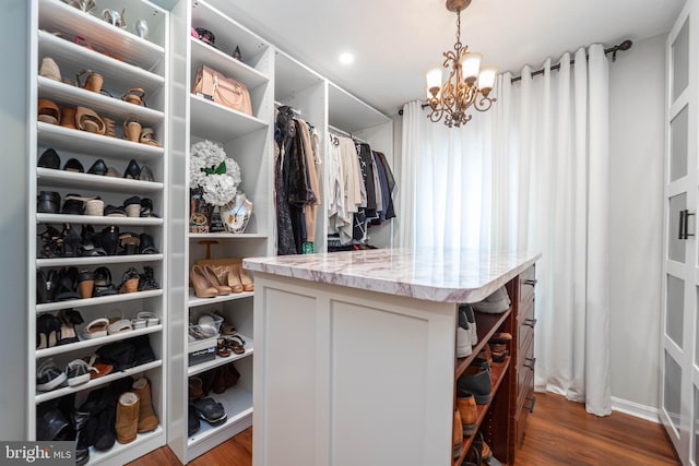 7781 Monaghan Rd, Glen Burnie, MD 21060 - walk in closet with a chandelier and dark wood-type flooring