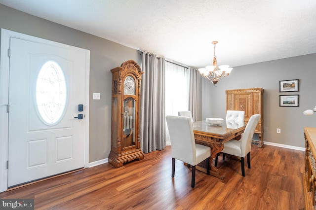 7781 Monaghan Rd, Glen Burnie, MD 21060 - dining room with a chandelier, healthy amount of natural light, and wood finished floors
