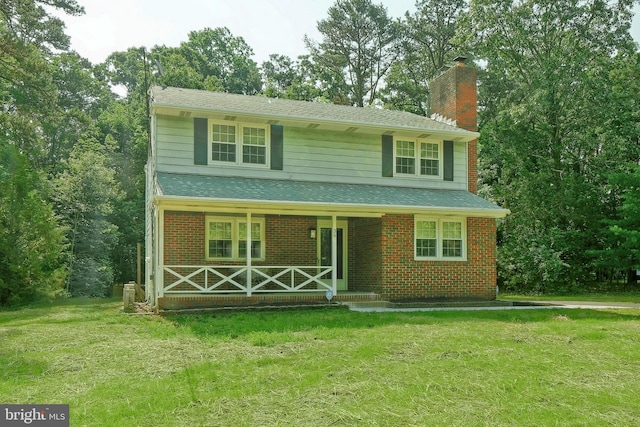 34 Barrett Ave, Hammonton, NJ 08037 - traditional-style home featuring a porch, a chimney, a front yard, and brick siding
