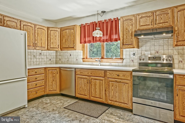 34 Barrett Ave, Hammonton, NJ 08037 - kitchen with stainless steel appliances, under cabinet range hood, light countertops, tasteful backsplash, and brown cabinetry