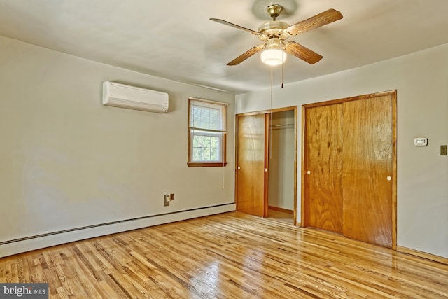 34 Barrett Ave, Hammonton, NJ 08037 - unfurnished bedroom with a wall unit AC, a baseboard radiator, wood finished floors, and a ceiling fan