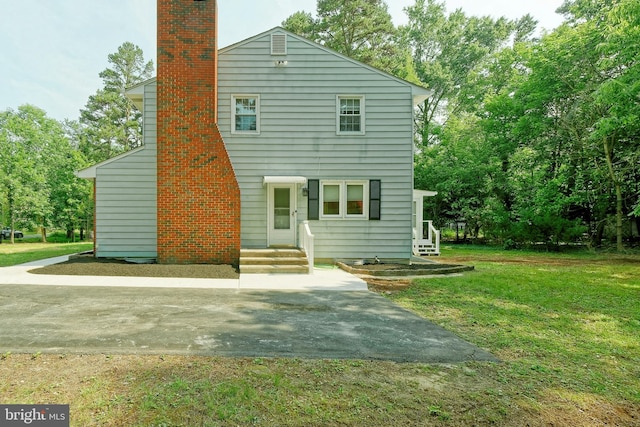 34 Barrett Ave, Hammonton, NJ 08037 - rear view of house with a lawn and a chimney