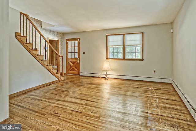 34 Barrett Ave, Hammonton, NJ 08037 - entrance foyer with stairway, a baseboard heating unit, and wood finished floors