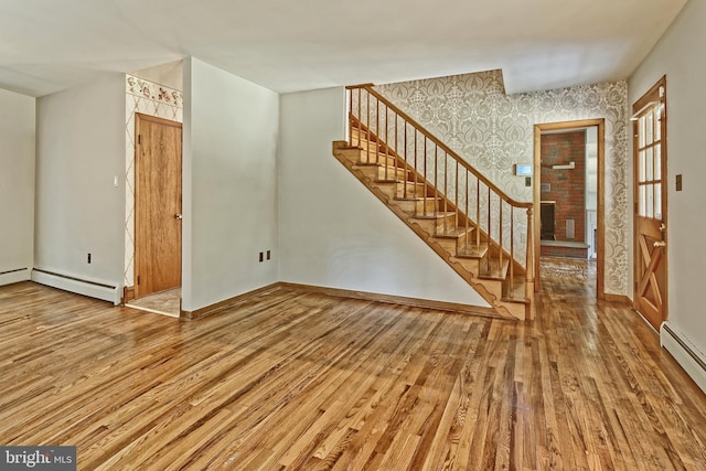 34 Barrett Ave, Hammonton, NJ 08037 - unfurnished living room with hardwood / wood-style floors, stairway, baseboard heating, and wallpapered walls
