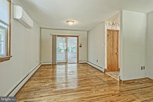 34 Barrett Ave, Hammonton, NJ 08037 - empty room featuring baseboard heating, a baseboard heating unit, a wall unit AC, and wood finished floors