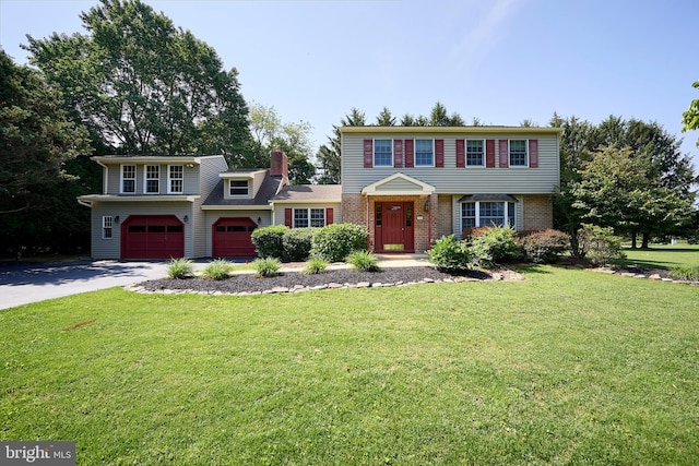 1500 Hillcrest Ln, Downingtown, PA 19335 - colonial-style house with driveway, an attached garage, a front lawn, brick siding, and a chimney