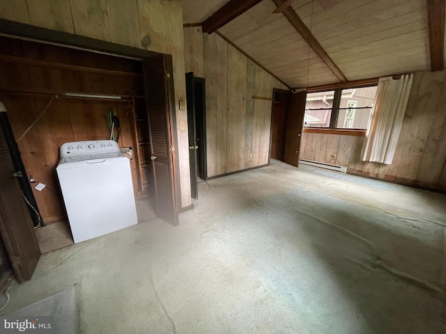 175 Howellsville Rd, Front Royal, VA 22630 - unfurnished room featuring washer / dryer, a baseboard heating unit, wooden walls, vaulted ceiling, and concrete flooring