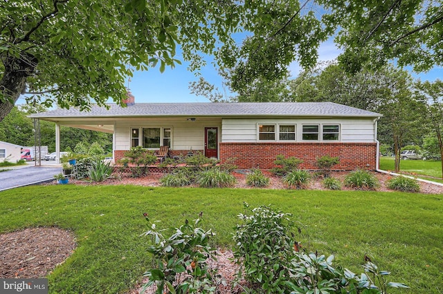 12105 Lanham Severn Rd, Bowie, MD 20720 - ranch-style house with brick siding, a front yard, and a chimney