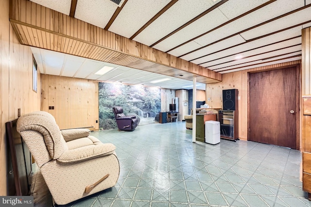 12105 Lanham Severn Rd, Bowie, MD 20720 - living room with wood walls and tile patterned floors